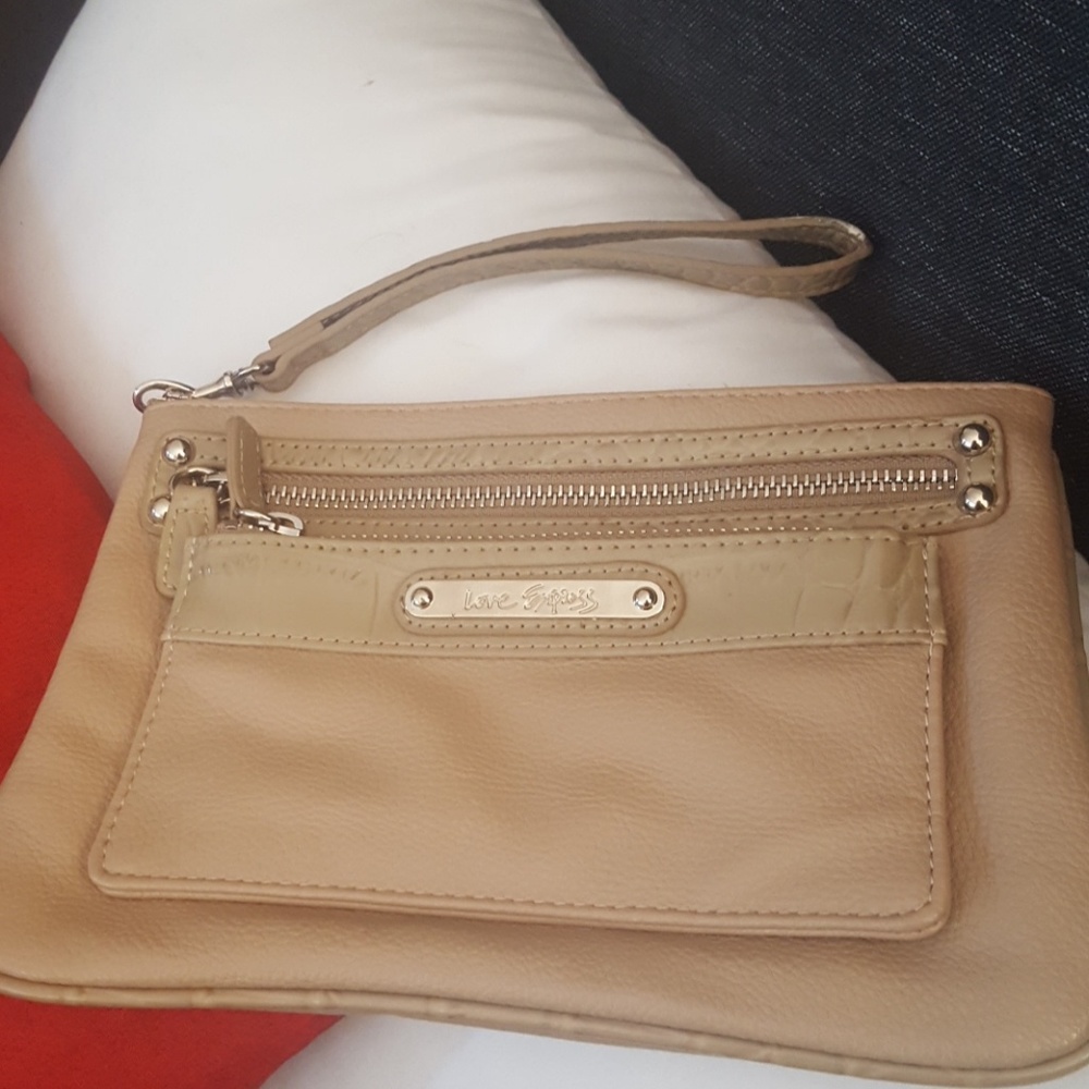 8in x 6in tan clutch with 3 zippered compartments